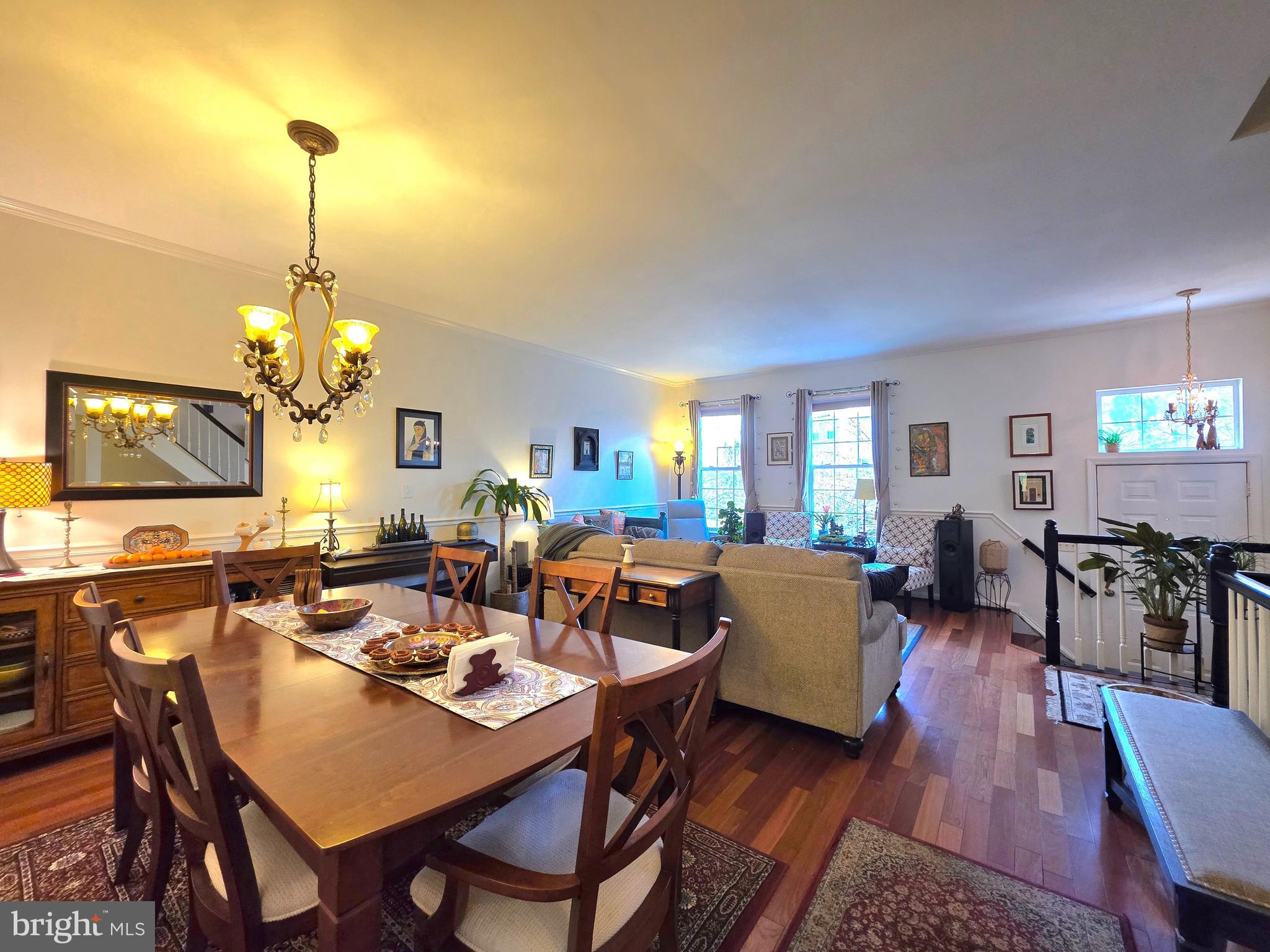 2826 Roesh Way Vienna, VA 22181 - Photo 6 of 36 a living room with lots of furniture dining table and a chandelier