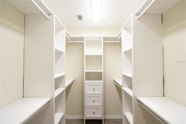 a bathroom with a sink vanity granite and a mirror