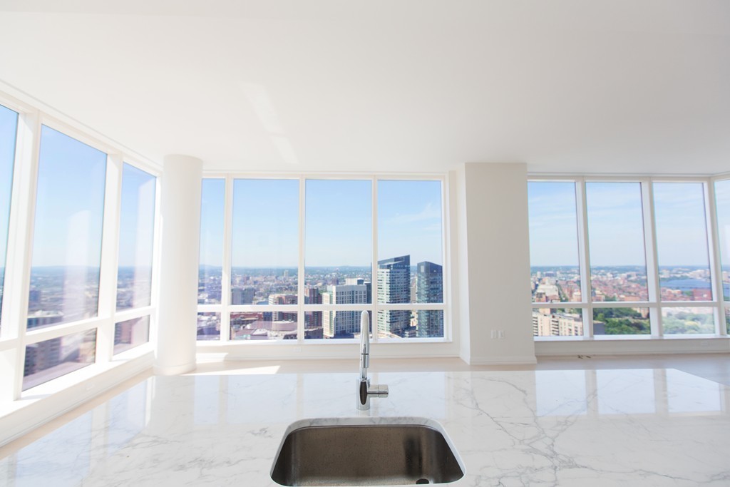 1 Franklin Street, Unit 4110 Boston, MA 02110 - Photo 5 of 8 a swimming pool with large glass windows and glass door