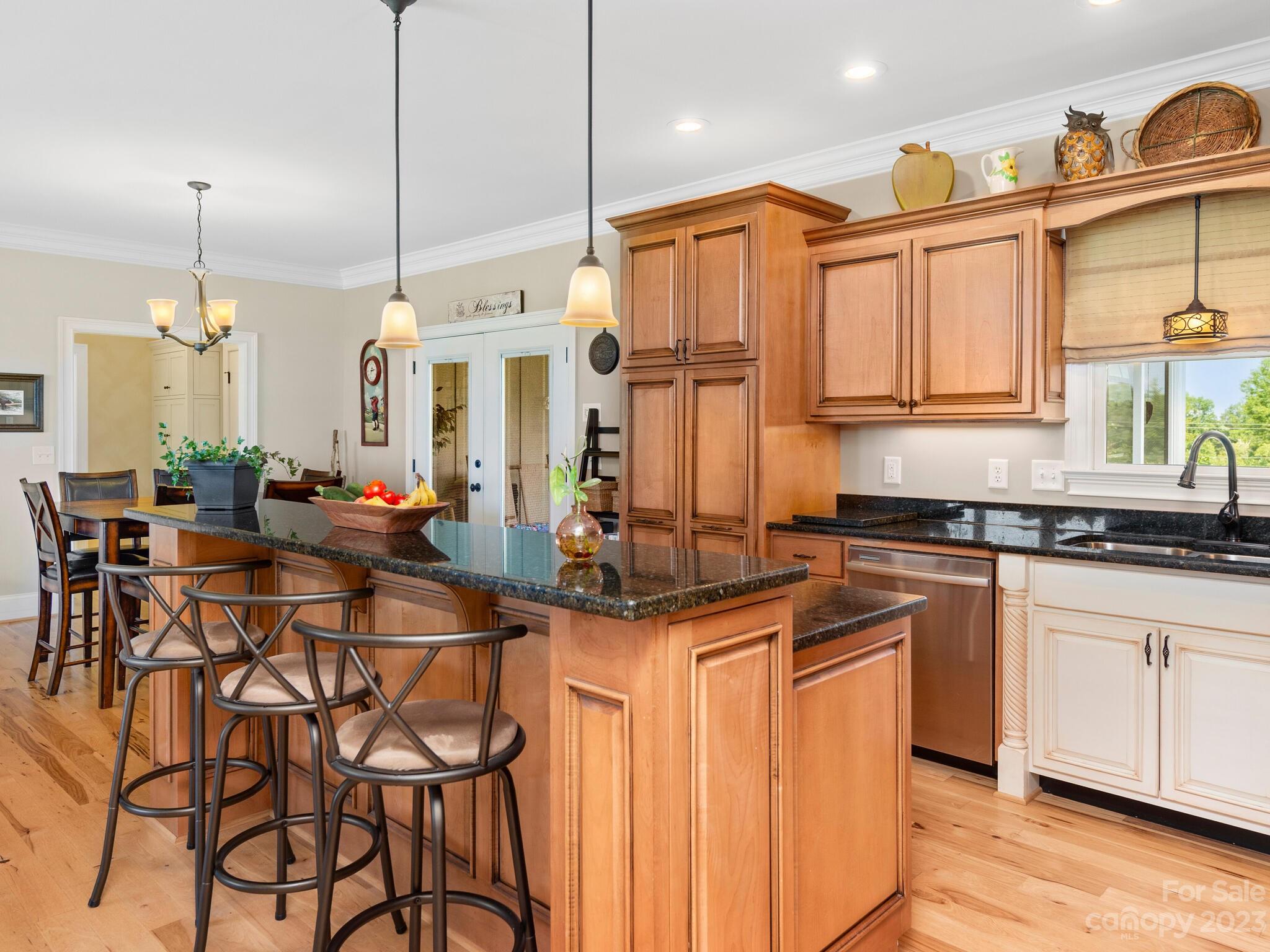 95 Fagan Road Columbus, NC 28722 - Photo 19 of 43 a kitchen with stainless steel appliances granite countertop a kitchen island a stove and a wooden floors