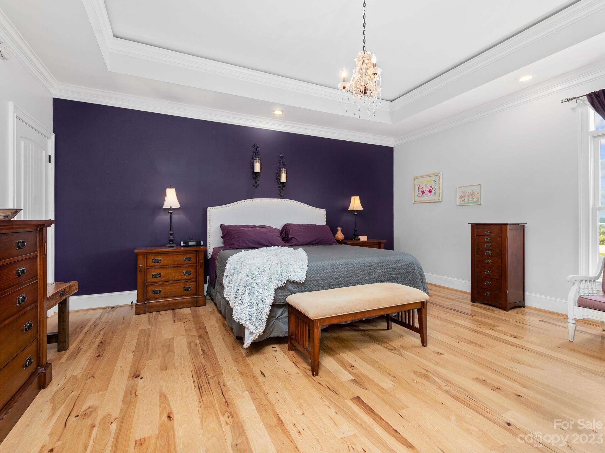 95 Fagan Road Columbus, NC 28722 - Photo 23 of 43 a bedroom with a bed and wooden floor