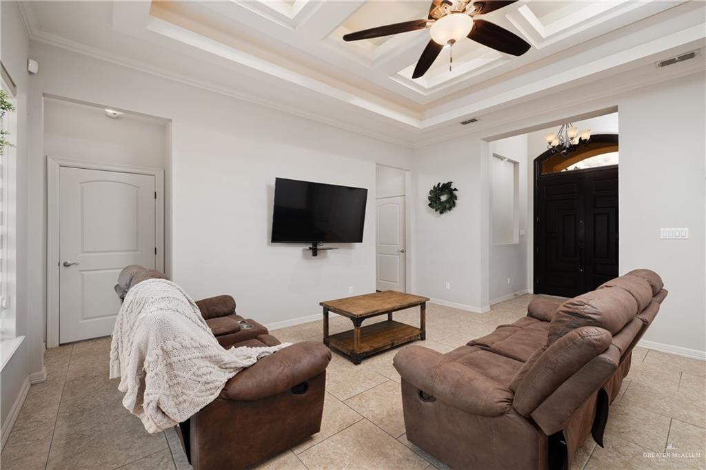 5007 June Court Edinburg, TX 78539 - Photo 2 of 14 a living room with furniture and a flat screen tv