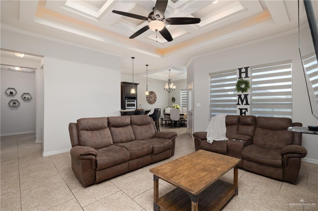 5007 June Court Edinburg, TX 78539 - Photo 3 of 14 a living room with furniture a ceiling fan and a rug