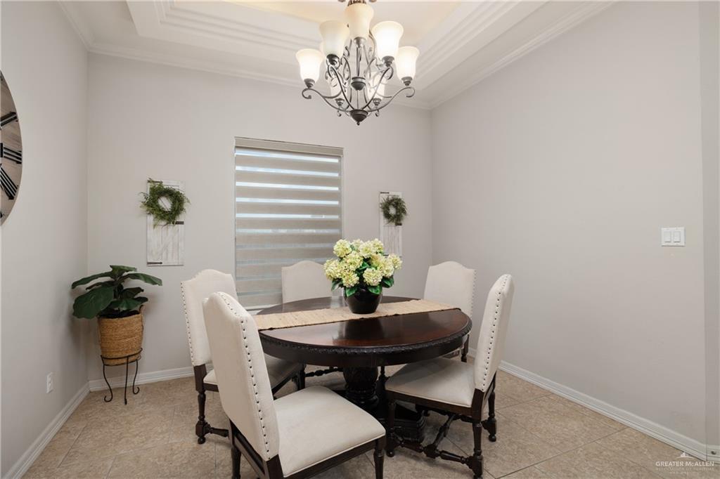 5007 June Court Edinburg, TX 78539 - Photo 4 of 14 a dining room with furniture and chandelier