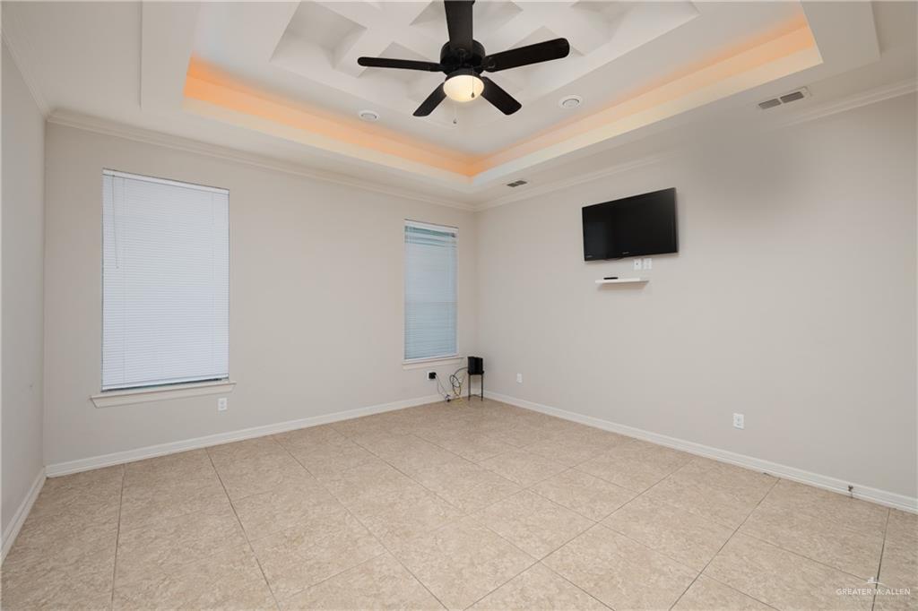 5007 June Court Edinburg, TX 78539 - Photo 8 of 14 a view of an empty room with a ceiling fan and a window