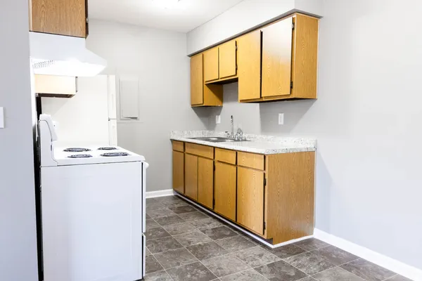 a utility room with cabinets washer and dryer