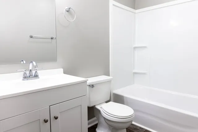 a bathroom with a sink a toilet and a bathtub