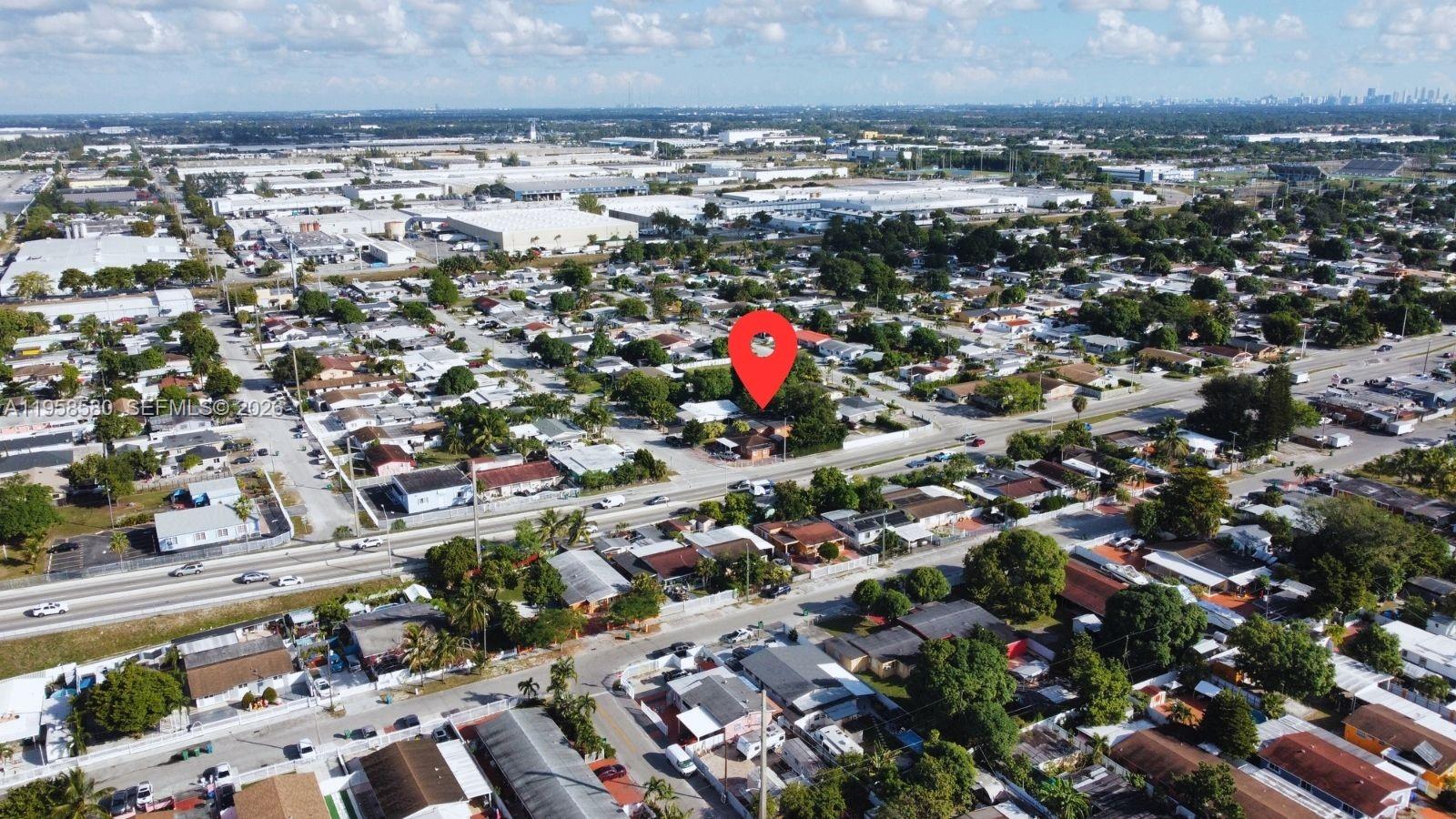 3575 Northwest 103rd Street Miami, FL 33147 - Photo 11 of 13 an aerial view of a city