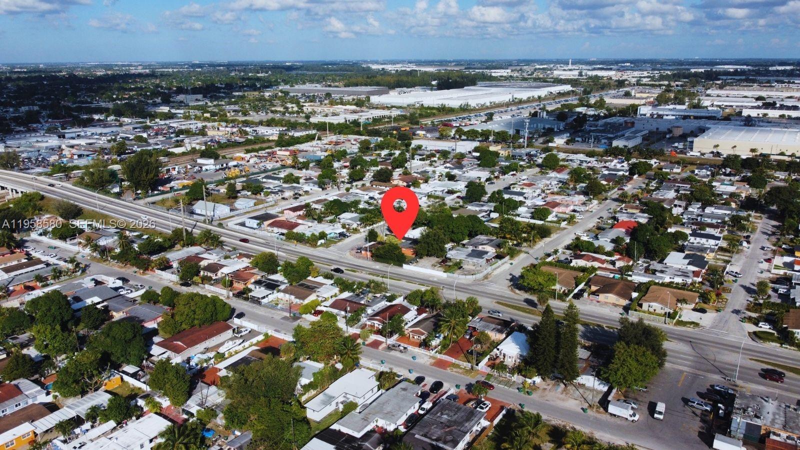 3575 Northwest 103rd Street Miami, FL 33147 - Photo 12 of 13 an aerial view of a city