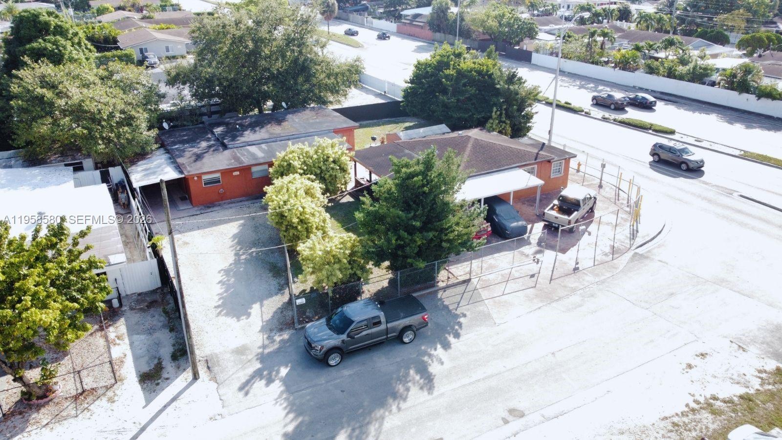 3575 Northwest 103rd Street Miami, FL 33147 - Photo 3 of 13 an aerial view of a house with outdoor space