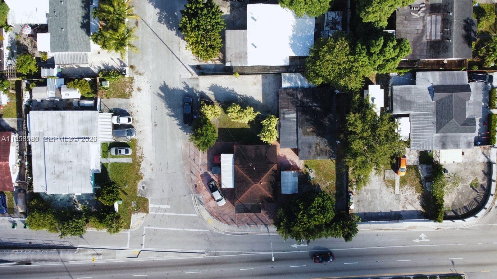 3575 Northwest 103rd Street Miami, FL 33147 - Photo 8 of 13 an aerial view of a house
