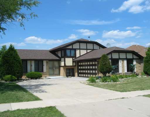 6938 Brementowne Road Tinley Park, IL 60477 - Photo 1 of 1 front view of a house with a street