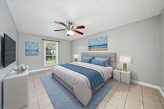 a bedroom with a large bed and a window