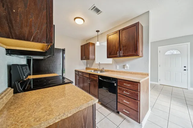 a bathroom with a sink double vanity and a mirror