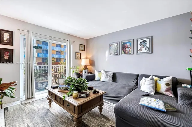 a living room with furniture and a large window