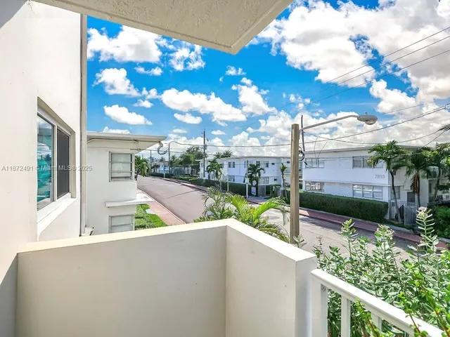 a view of a house with a backyard and a patio