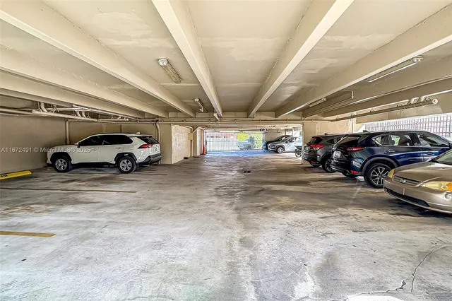 a view of parking space with parked cars