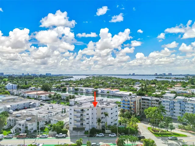 a view of a house with a flower garden