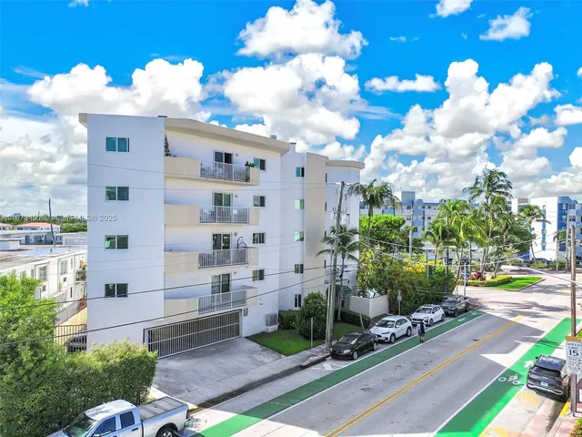 a front view of a building with garden