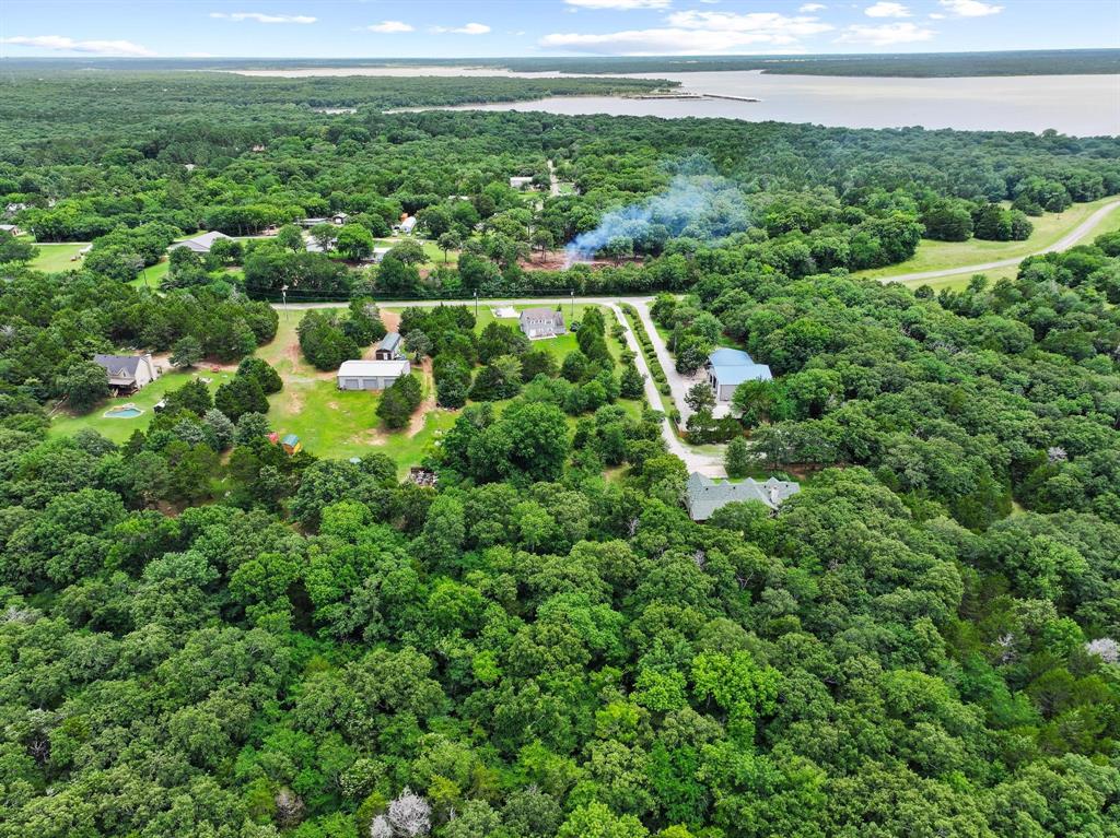 207 Paradise Park Road Pottsboro, TX 75076 - Photo 22 of 28 Expansive wooded property featuring a natural landscape and distant water body