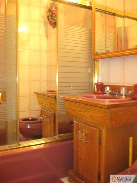 194 Midfield Road Colonia, NJ 07067 - Photo 14 of 25 a bathroom with a sink and a shower