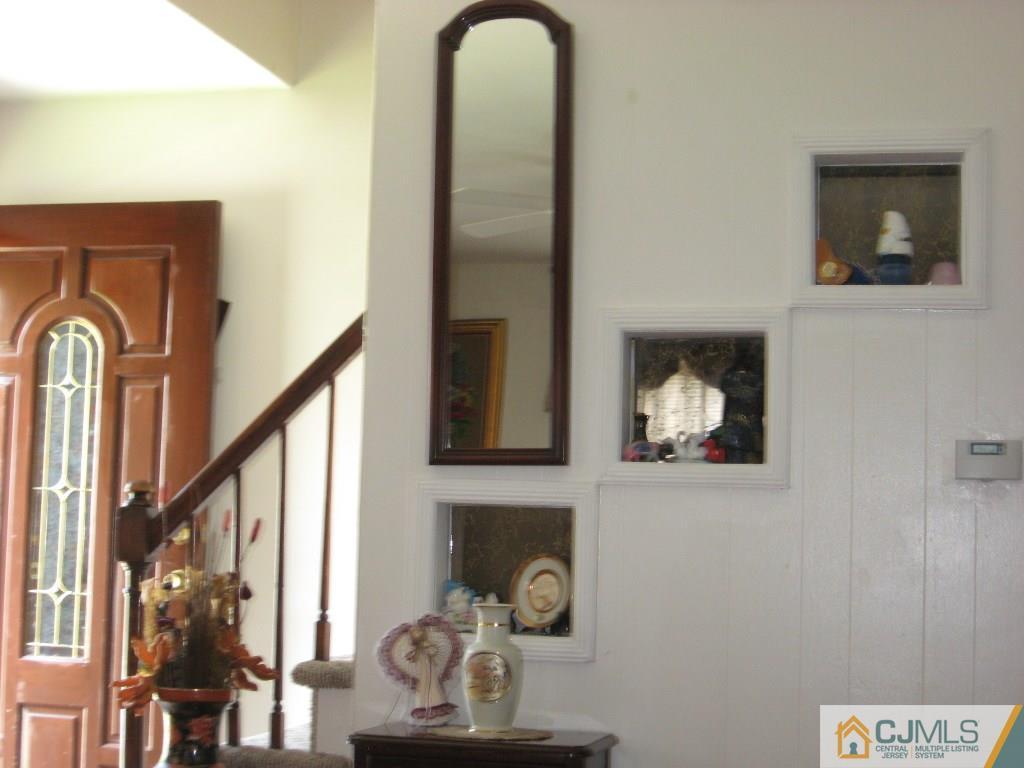 194 Midfield Road Colonia, NJ 07067 - Photo 3 of 25 a view of a livingroom with furniture and hallway