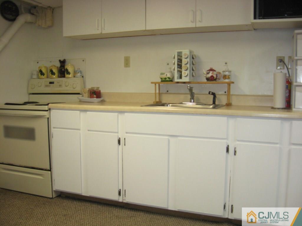194 Midfield Road Colonia, NJ 07067 - Photo 21 of 25 a kitchen with a sink and cabinets
