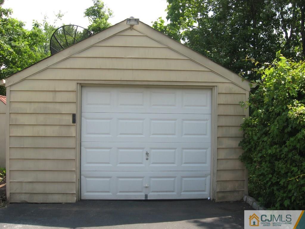 194 Midfield Road Colonia, NJ 07067 - Photo 23 of 25 a small white building with a outdoor space