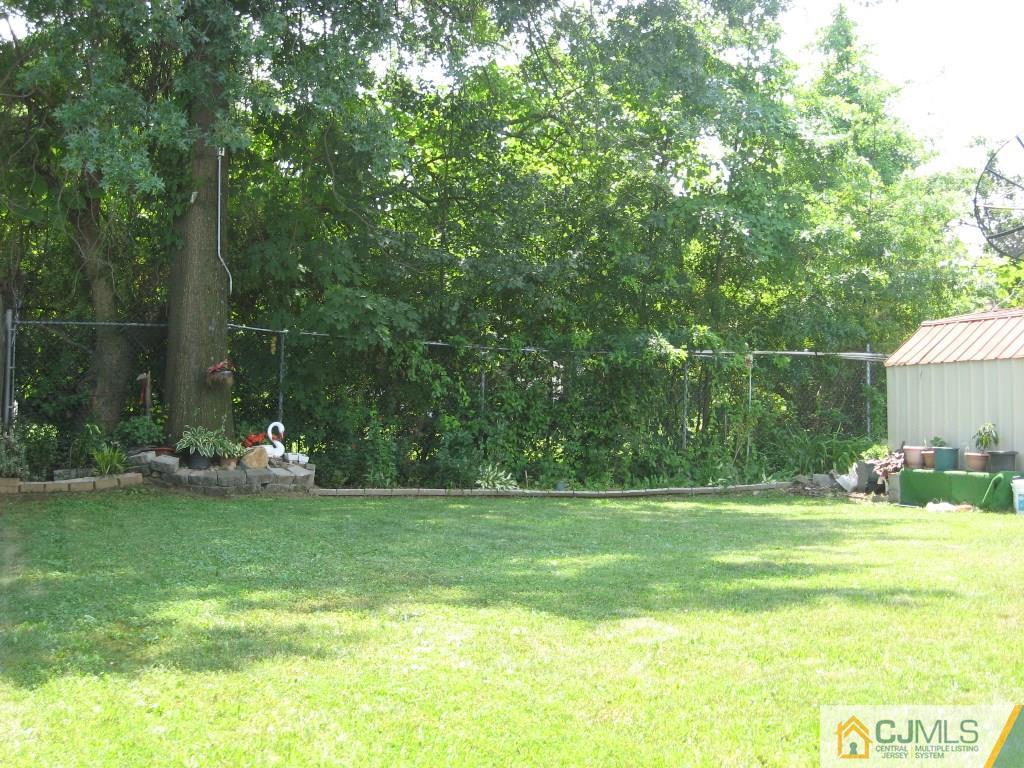 194 Midfield Road Colonia, NJ 07067 - Photo 24 of 25 a view of a park with large trees