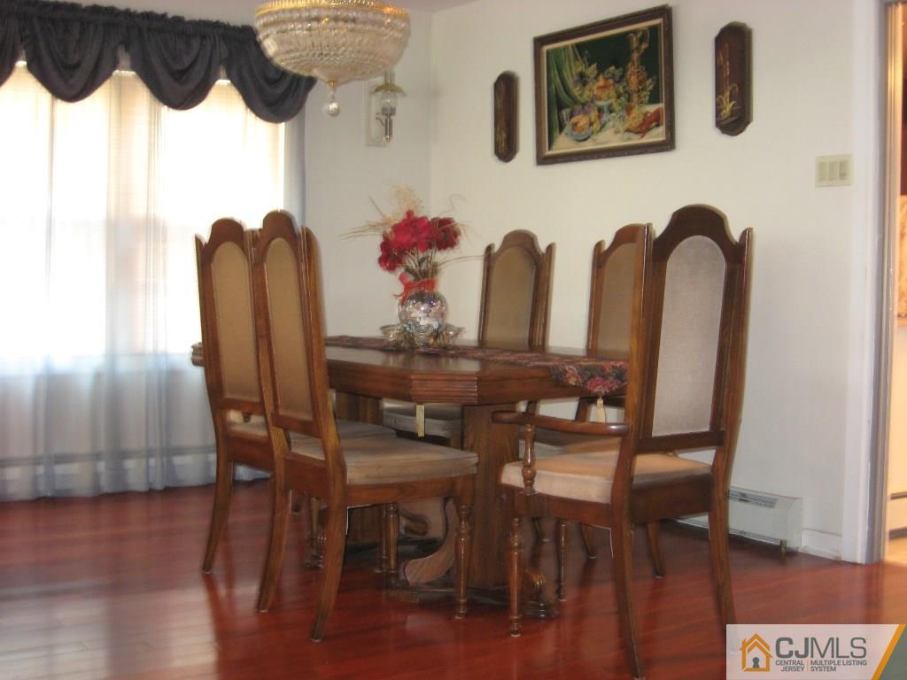 194 Midfield Road Colonia, NJ 07067 - Photo 7 of 25 a view of a dining room with furniture and wooden floor