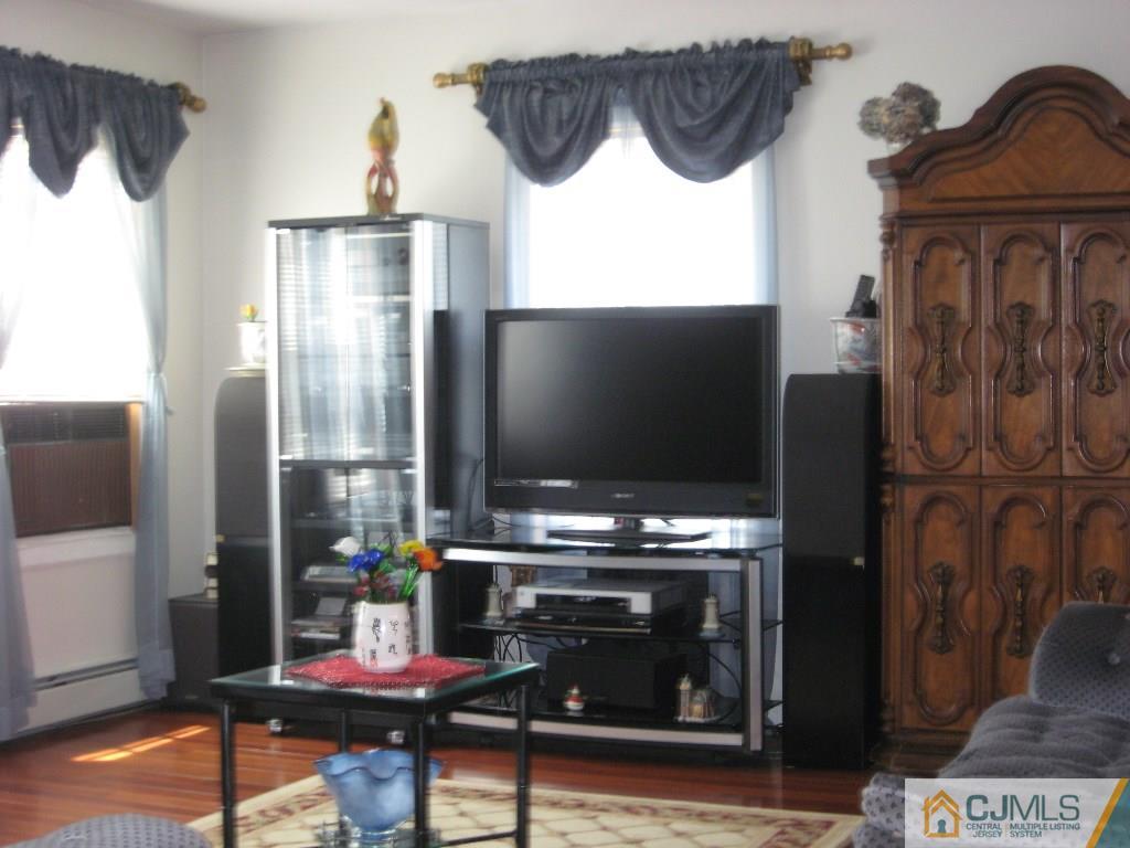 194 Midfield Road Colonia, NJ 07067 - Photo 8 of 25 a kitchen with a refrigerator and a stove