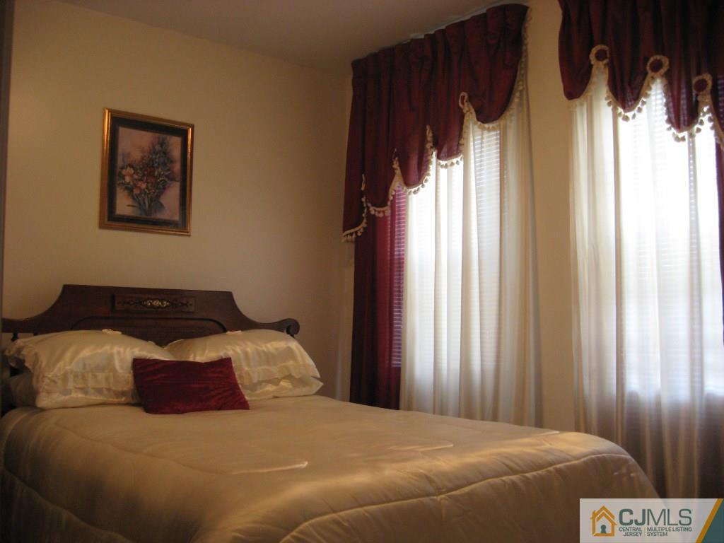 194 Midfield Road Colonia, NJ 07067 - Photo 10 of 25 a bedroom with a bed and a window