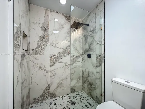 a bathroom with a toilet and a sink