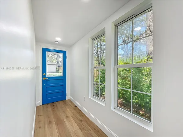a view of an empty room with a window
