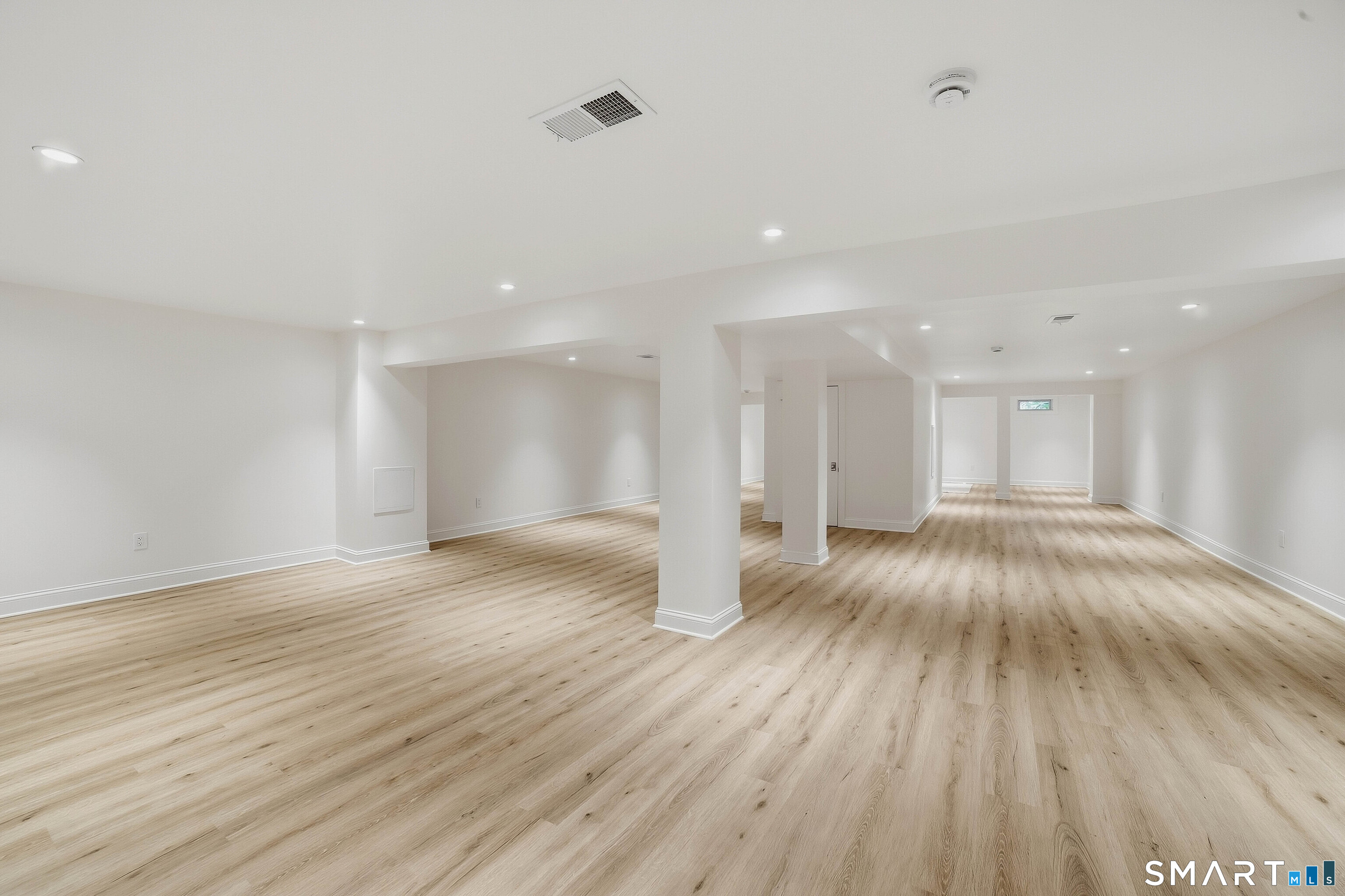 855 Prospect Street Hamden, CT 06517 - Photo 27 of 35 Fully finished heated and air conditioned lower level ideal for rec room or media room. There is a half bath on this level.