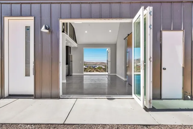 a view of an entryway with wooden floor