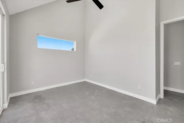 a view of a glass door next to a yard