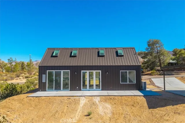 a view of a building with a mountain in the background