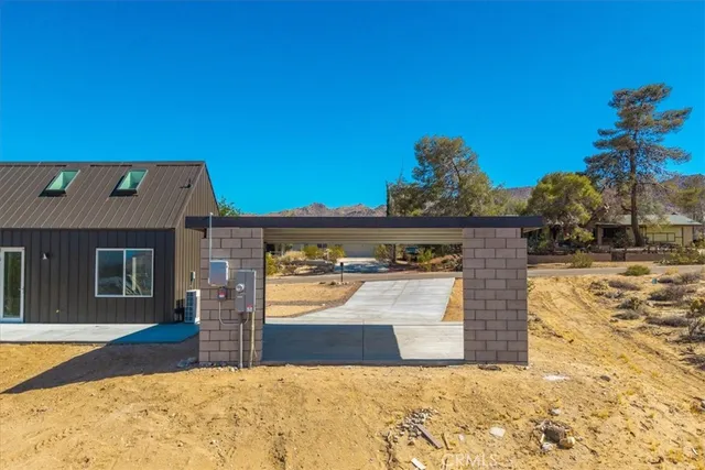 a view of a town with mountains in the background