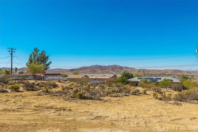 view of a bathroom with a large window and brick walls
