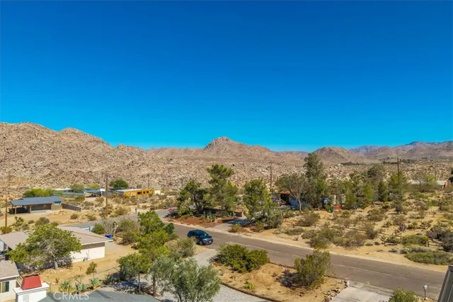 an aerial view of residential house and green space