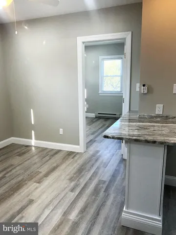 a view of a kitchen cabinets and wooden floor