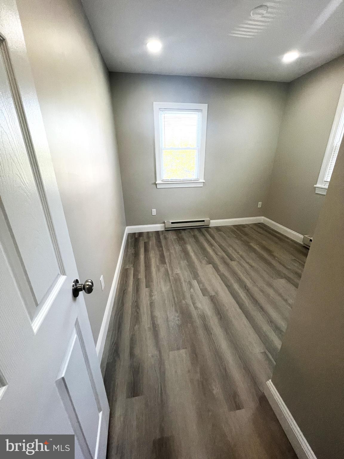 30 Spruce Avenue, Unit B Maple Shade, NJ 08052 - Photo 15 of 23 an empty room with wooden floor and windows