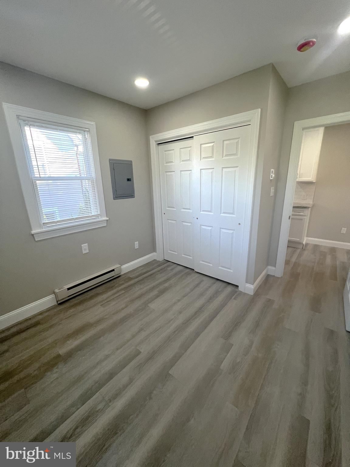30 Spruce Avenue, Unit B Maple Shade, NJ 08052 - Photo 16 of 23 an empty room with wooden floor and windows