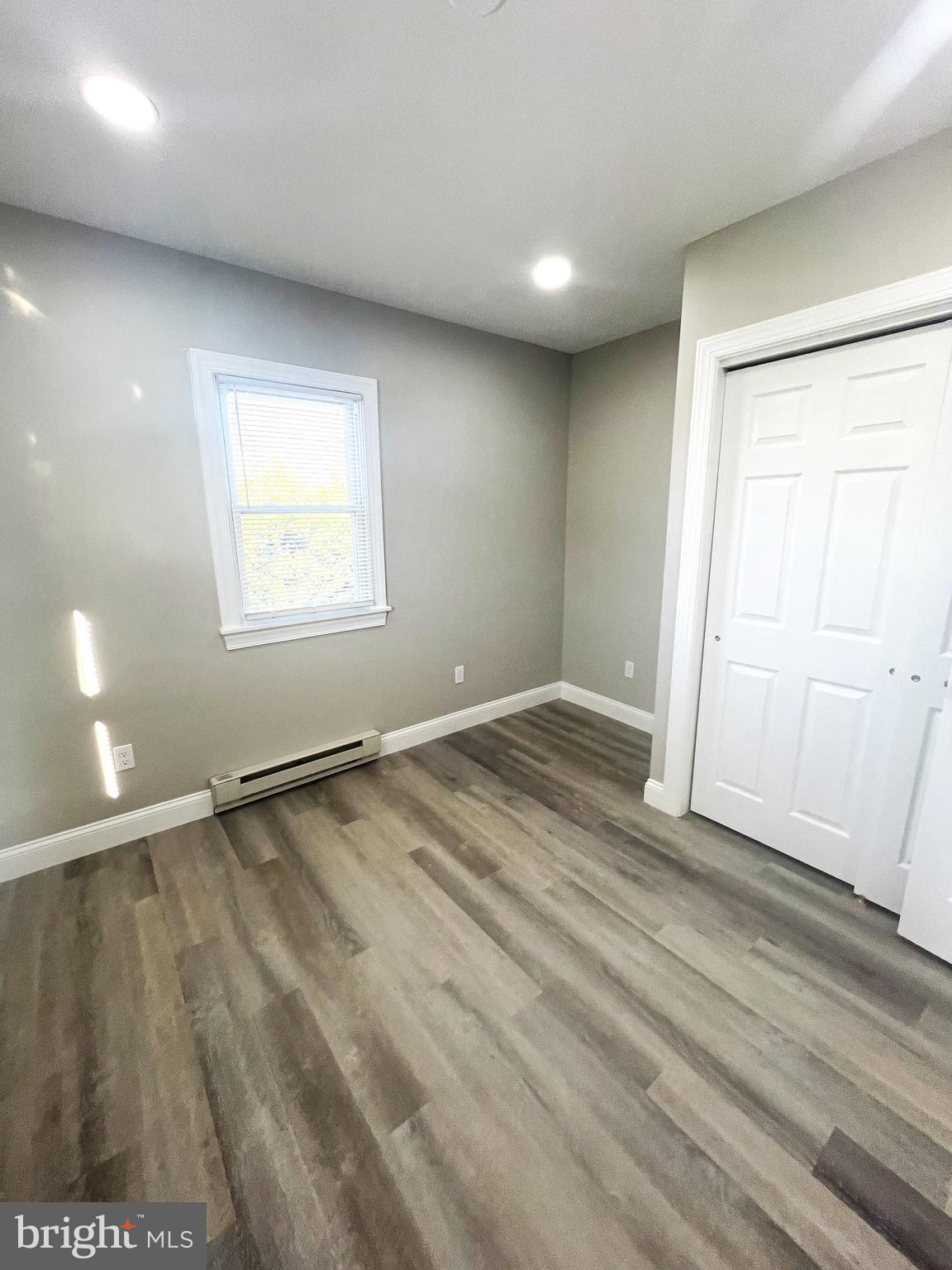 30 Spruce Avenue, Unit B Maple Shade, NJ 08052 - Photo 19 of 23 an empty room with wooden floor and windows
