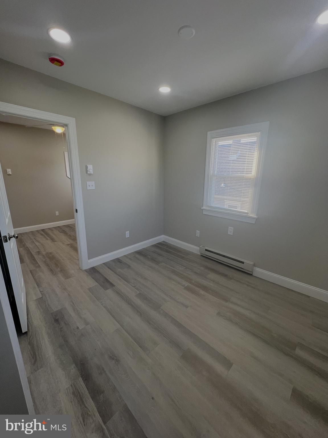 30 Spruce Avenue, Unit B Maple Shade, NJ 08052 - Photo 21 of 23 an empty room with wooden floor and windows