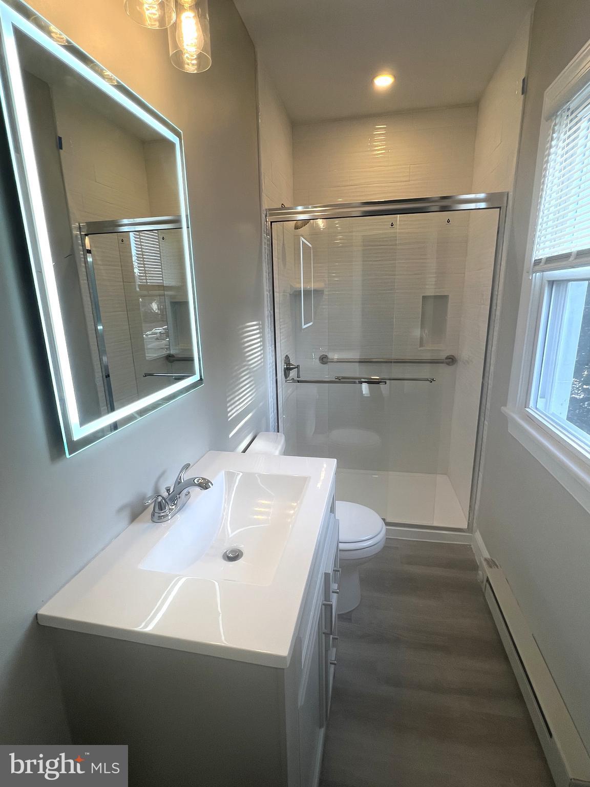 30 Spruce Avenue, Unit B Maple Shade, NJ 08052 - Photo 22 of 23 a bathroom with a sink a toilet and shower