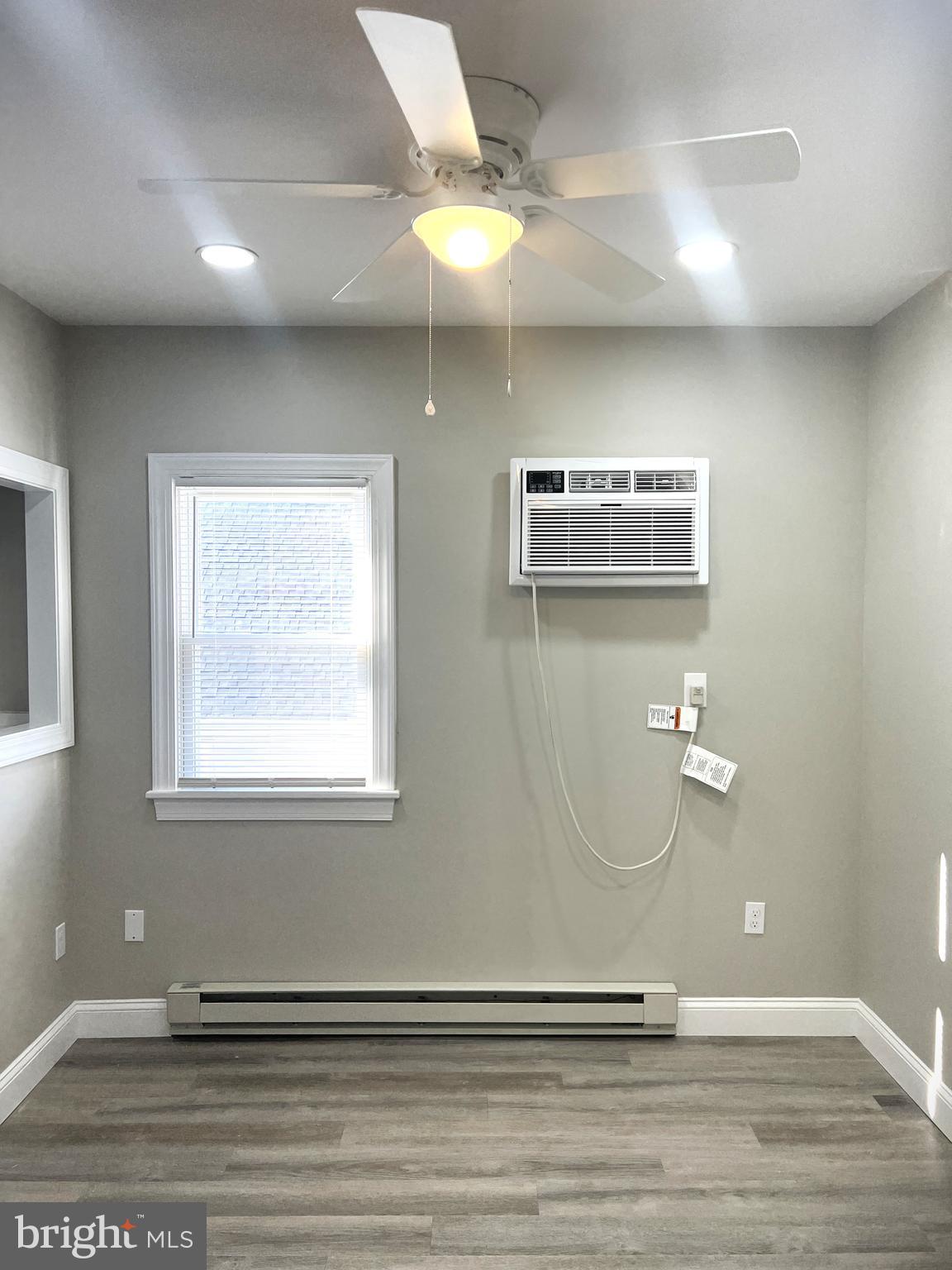 30 Spruce Avenue, Unit B Maple Shade, NJ 08052 - Photo 3 of 23 a view of a livingroom with wooden floor and a ceiling fan