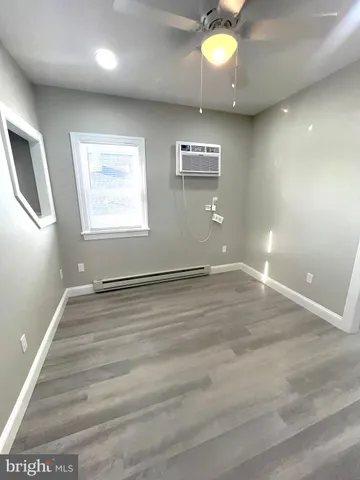 an empty room with a empty space and windows