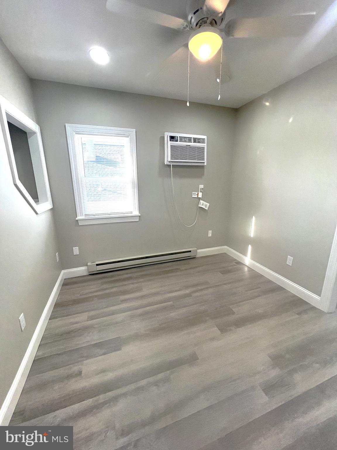 30 Spruce Avenue, Unit B Maple Shade, NJ 08052 - Photo 4 of 23 an empty room with a empty space and windows